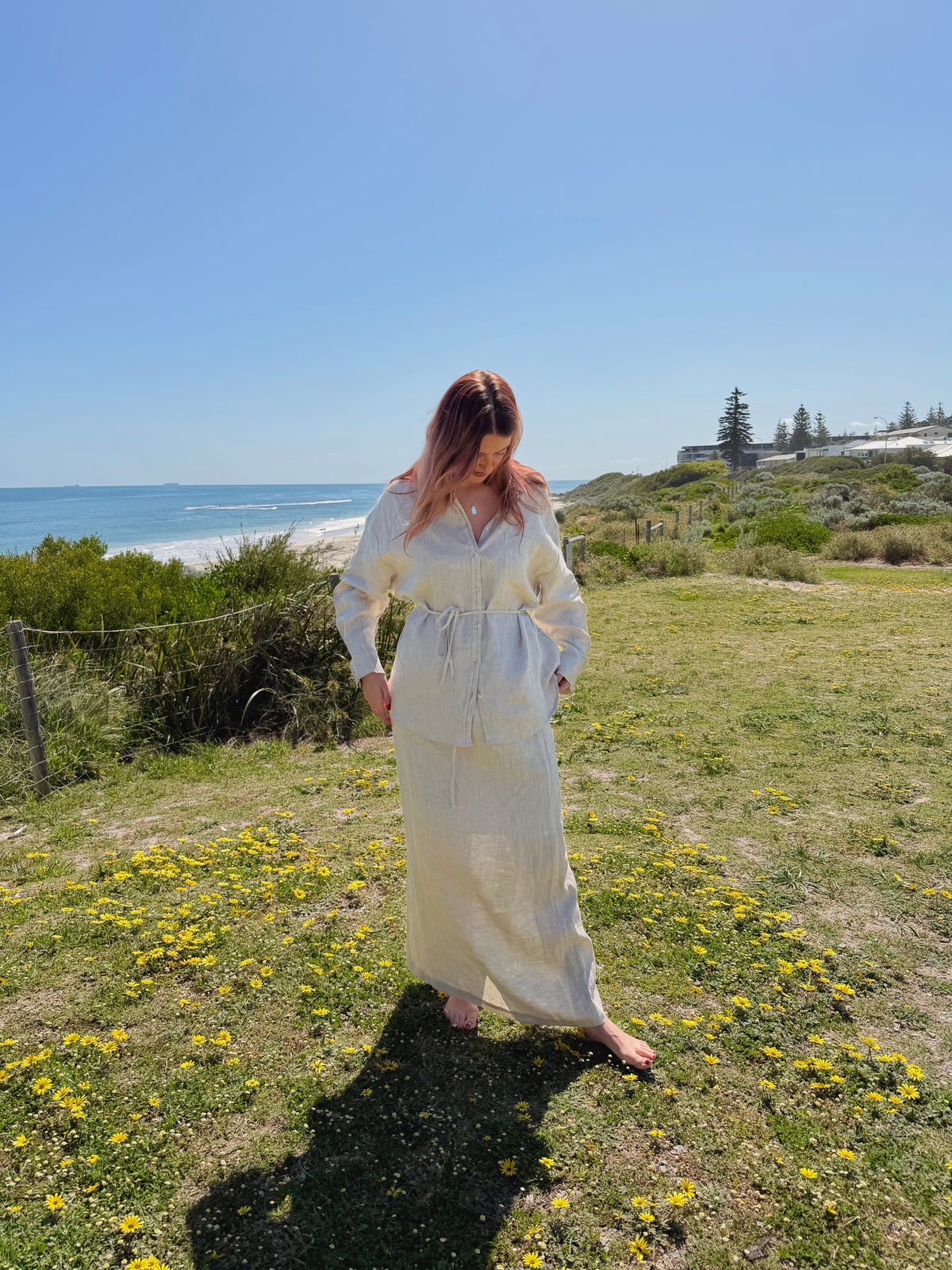 White linen two-piece outfit with patch pockets, button-front tunic, drawstring waist, long skirt
