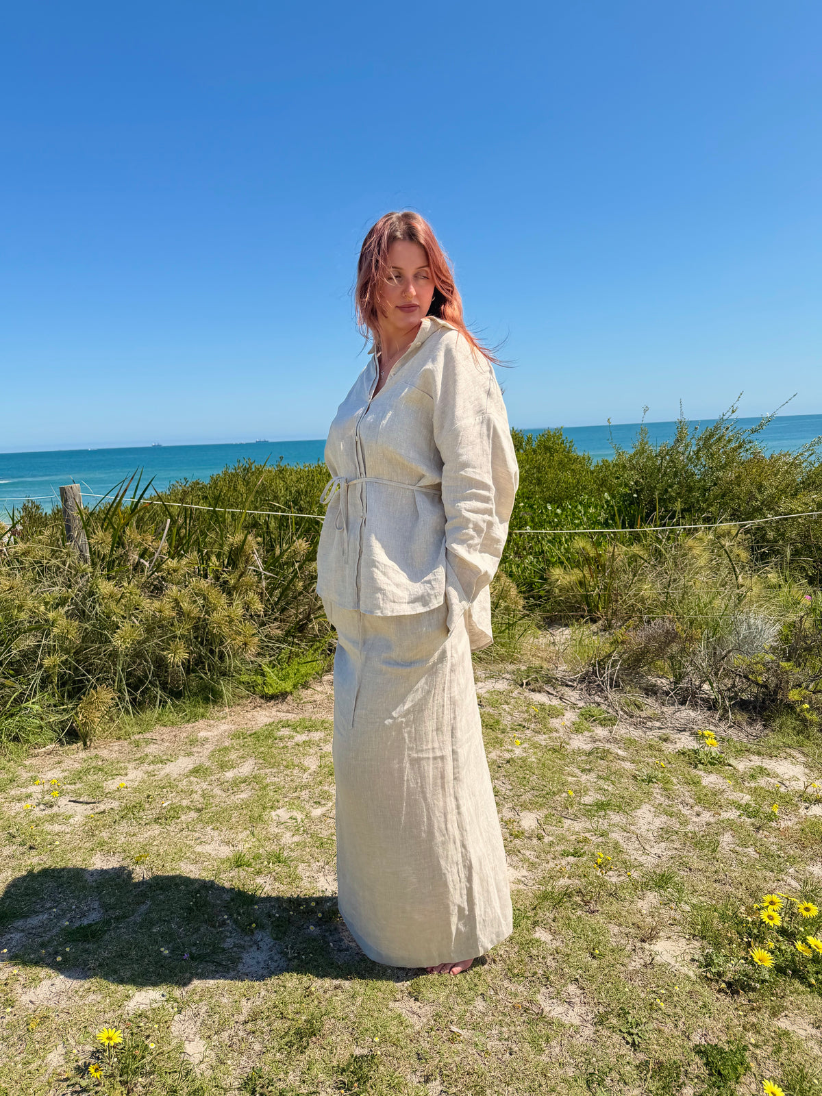 White linen two-piece set with button-front tunic and drawstring waist, long skirt