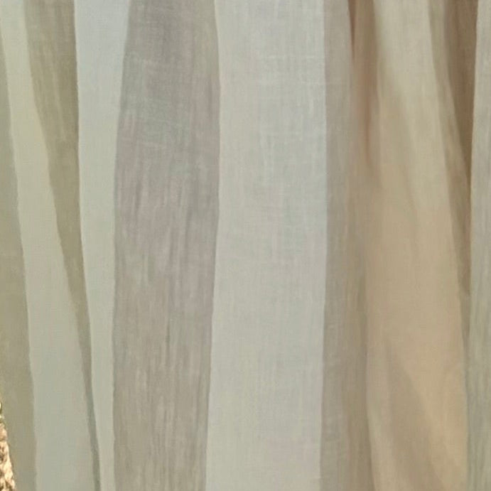 Rust boxy tee with short sleeves and crew neck, draped relaxed silhouette.