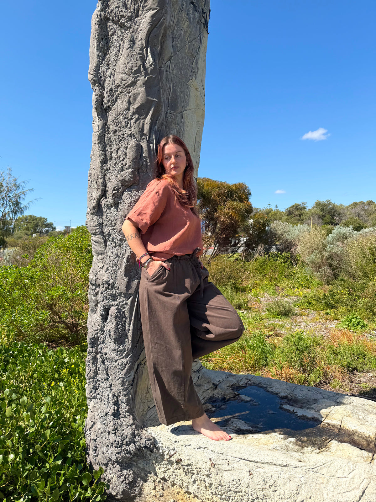 Khaki barrel pants with cuffed wide legs and adjustable drawstring waist