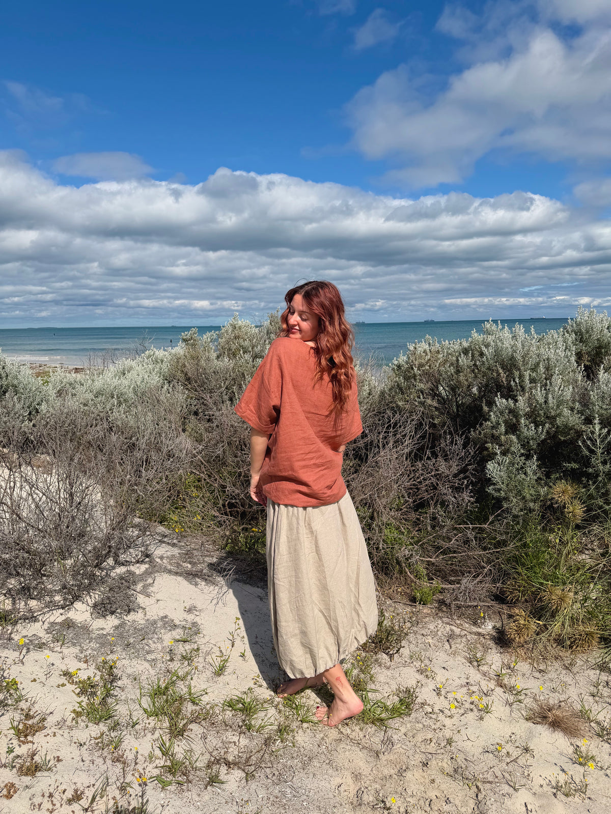 Natural woven tulip-style forage skirt, gathered midi with full ruched hem and folds