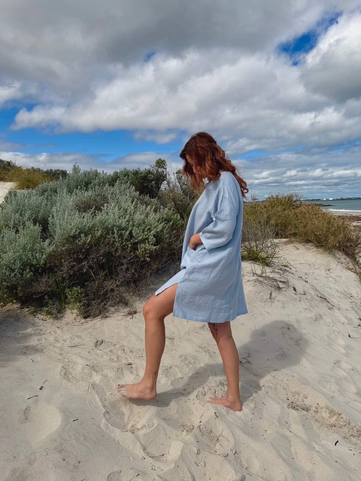 Light blue tee tunic dress with tie belt, 3/4 sleeves and knee-length hem