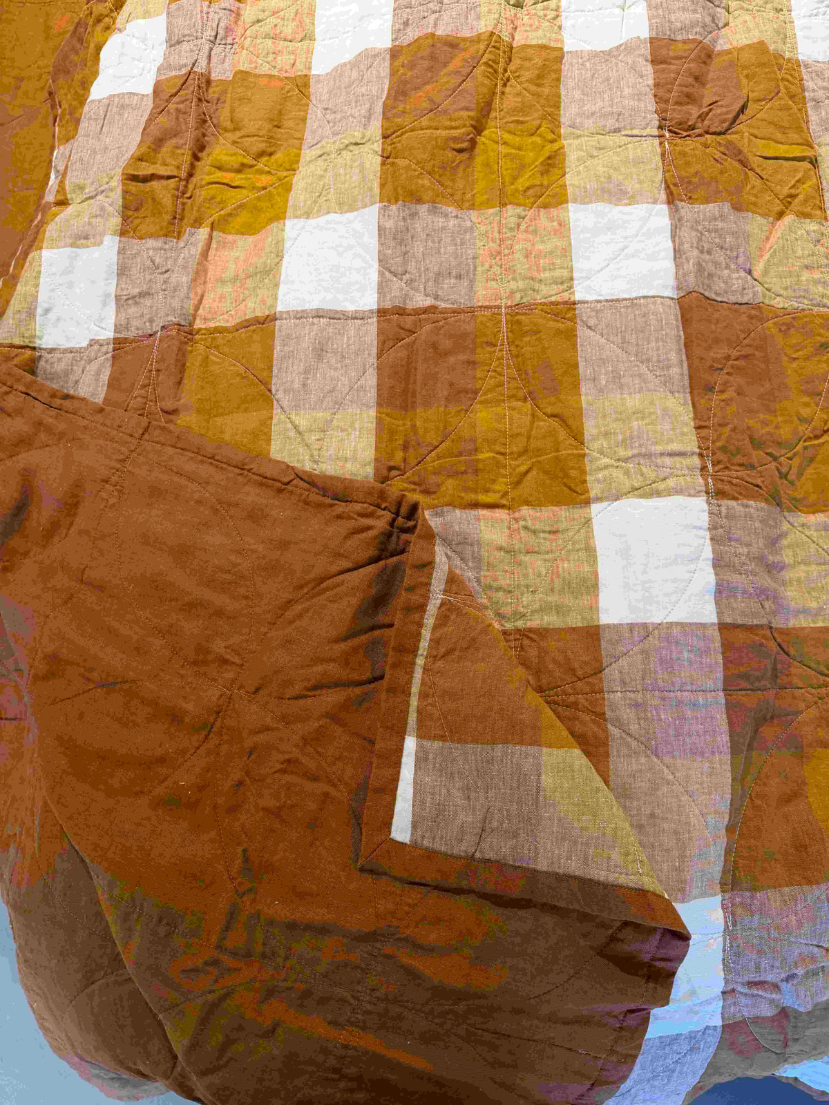 Terracotta flax linen blanket with check pattern and stitched edge