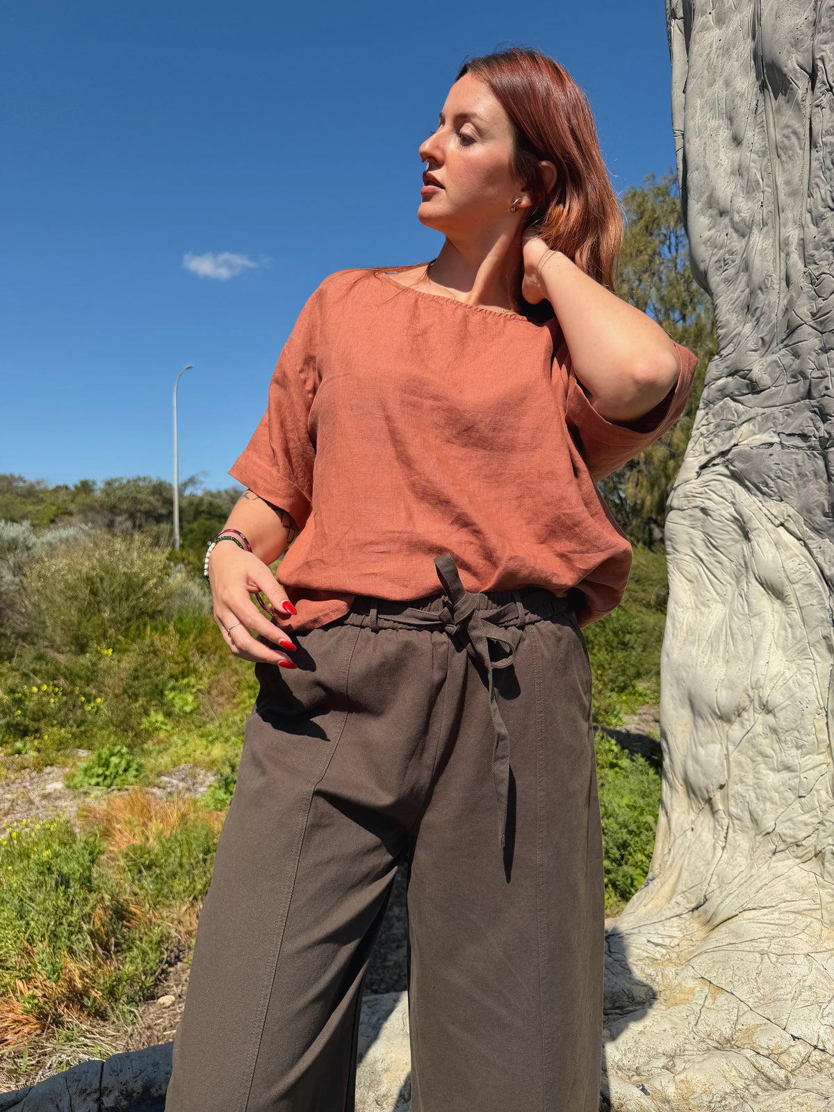 Khaki barrel pants with front ties and relaxed wide-leg fit