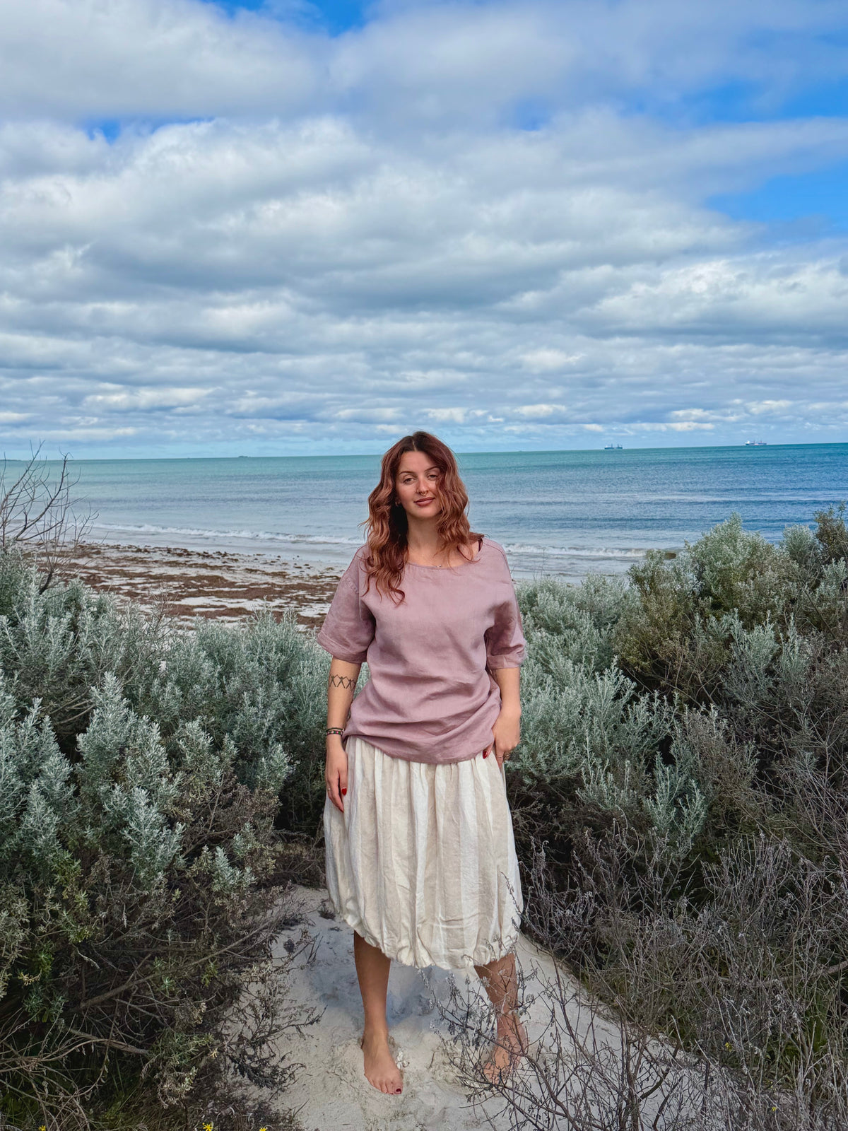Tulip-style mid-length market skirt, light natural, gathered tulip waist and soft ruffle