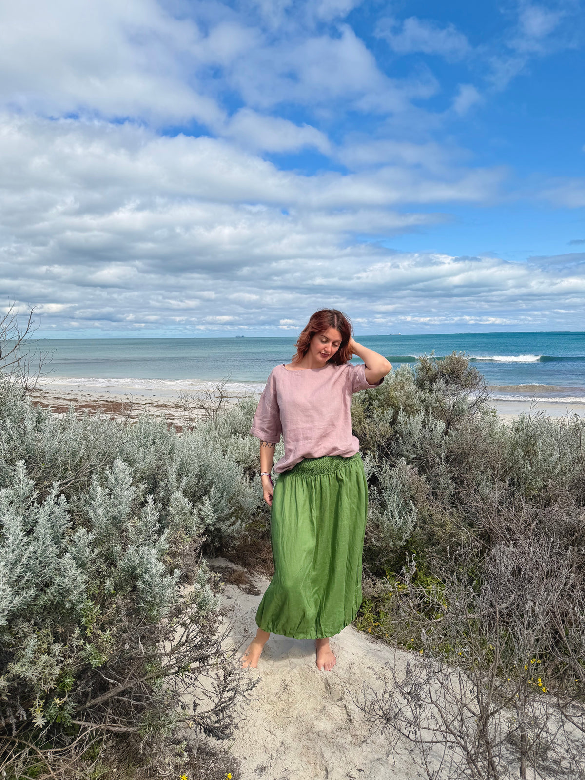 Green maxi tulip skirt with flowing drape and ankle-length gathered fabric