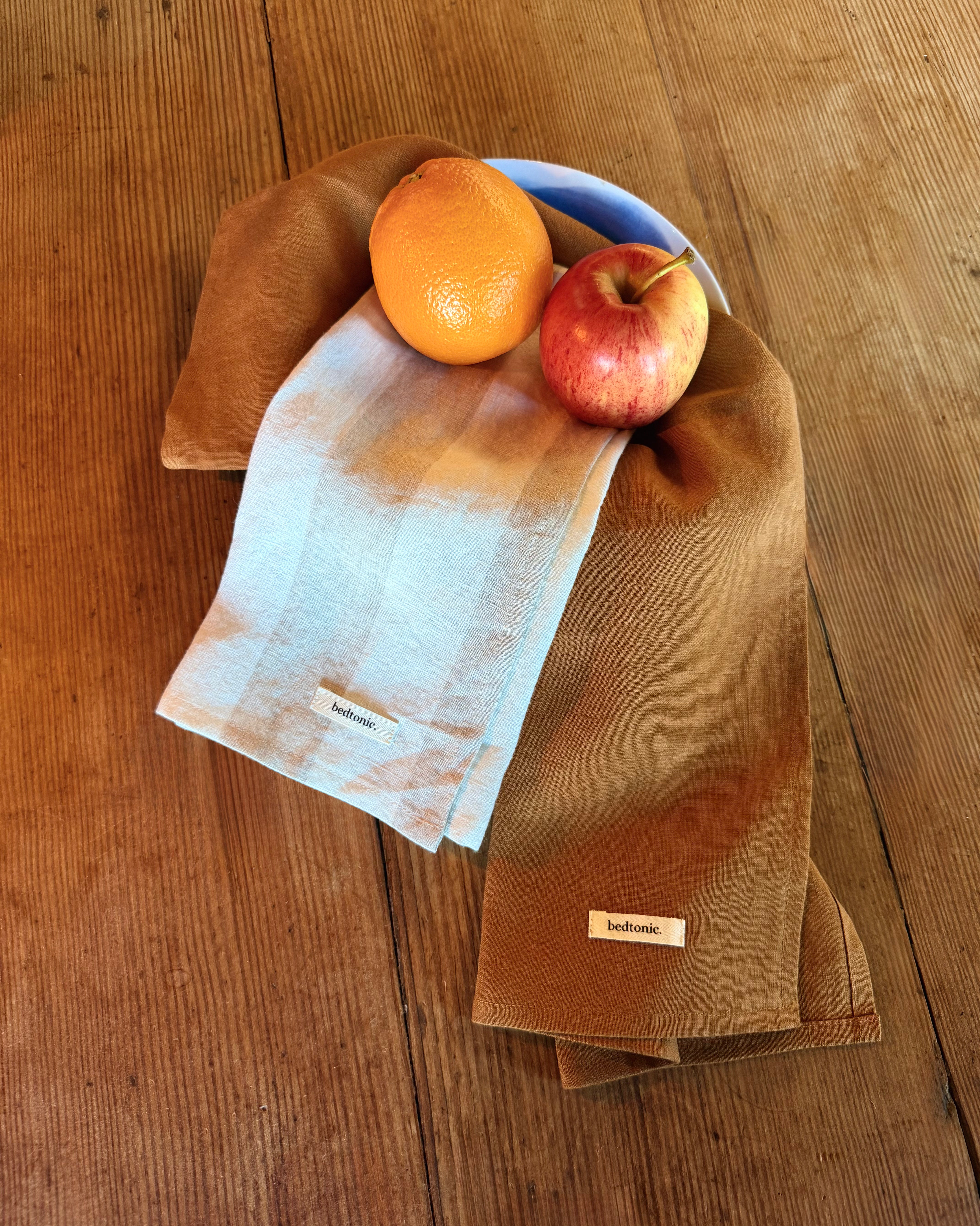Linen tea towel set piece in olive-brown with folded edge and woven fabric label